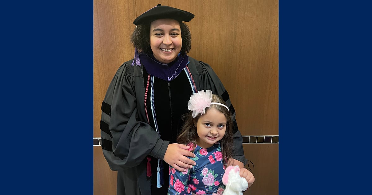 Mina Woodard, who graduated from WMU-Cooley Law School in December with a perfect 4.0 GPA, is pictured at graduation with her daughter, Skye.